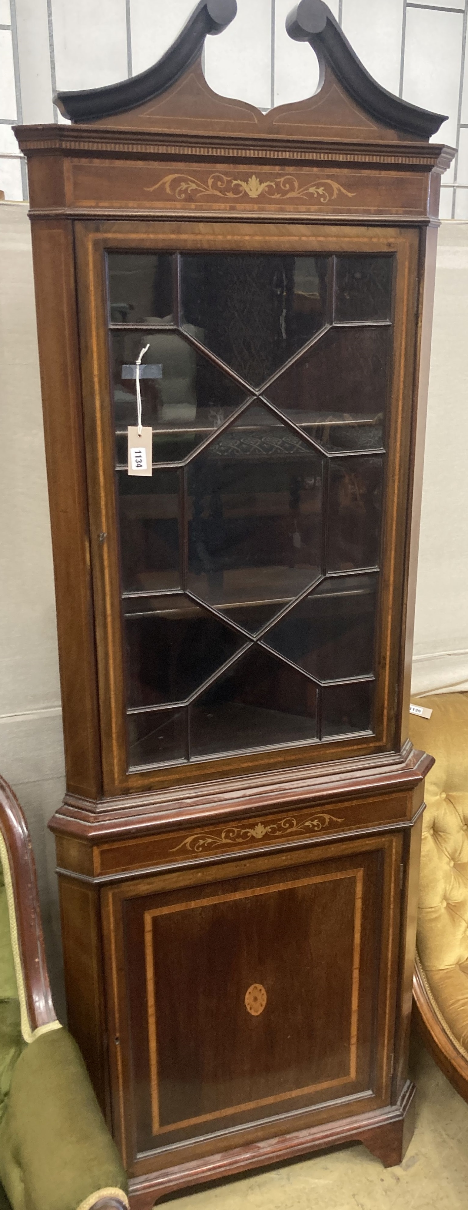 An Edwardian marquetry inlaid and cross banded mahogany standing corner cabinet, width 70cm, depth 40cm, height 205cm